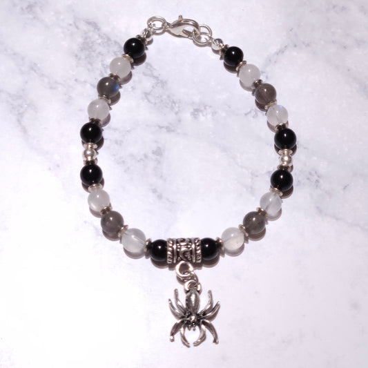 Beaded spider bracelet with dark and pale stones, silver bead accents and hanging spider charm