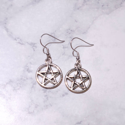 Silver pentacle charm earrings featuring circular pentagram and hanging hooks