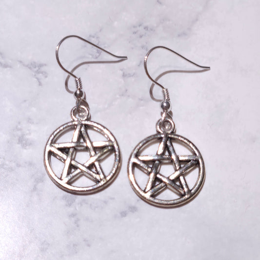 Silver pentagram charm earrings with dangling circular pendants and hook backs