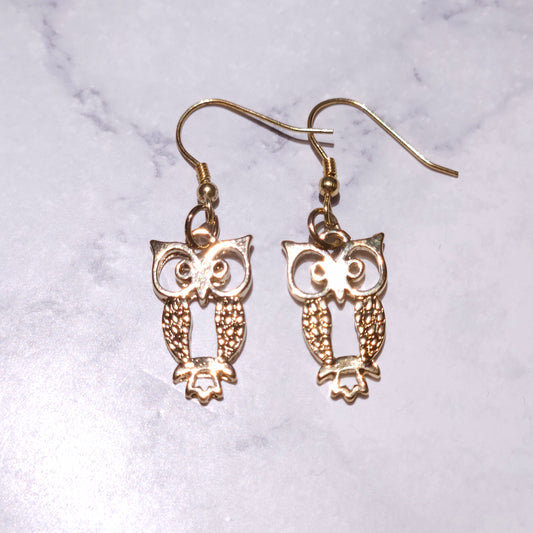 Gold-tone owl charm drop earrings with circular owl wings and fishhook closures