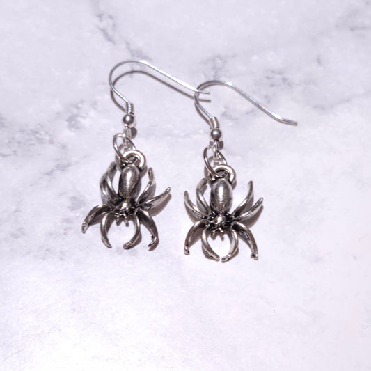 Silver spider drop earrings with circular charm loops and eight-leg spider detail