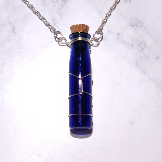 Cobalt blue spell bottle pendant on silver chain with cork stopper and wire frame