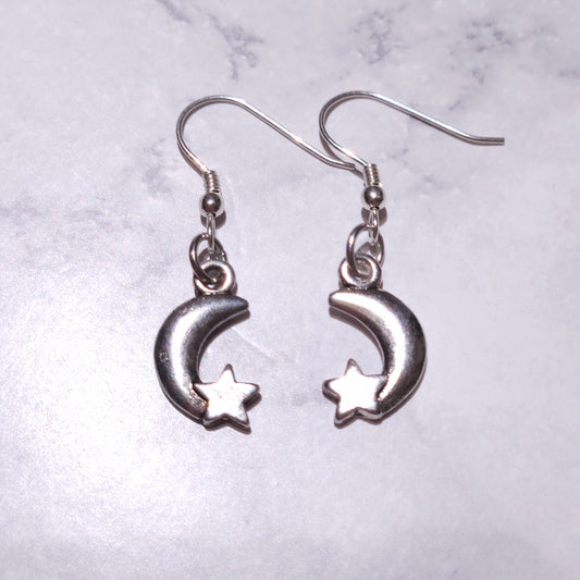 Pair of silver crescent moon and star charm hook earrings, mirrored moon design